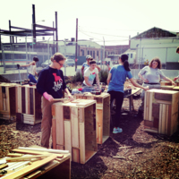 Volunteers work with Future Green to create repurposed Planters for 9th Street Wildflower Corridor, Brooklyn, New York, 2014.